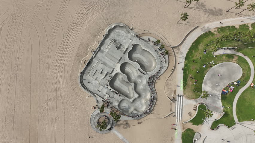 Venice Beach, California, USA - Aerial View of Rotating Skating Park at the Ocean Boardwalk With People Skating