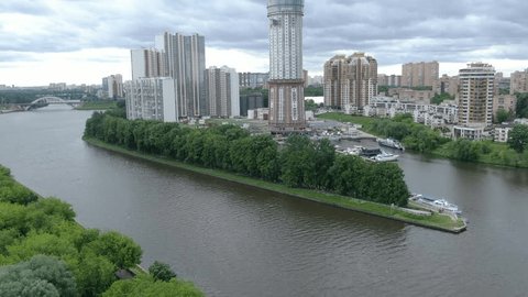 Aerial Ascent over Riverside District Tall Buildings