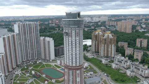 Drone Circling around Tall Residential Tower Building