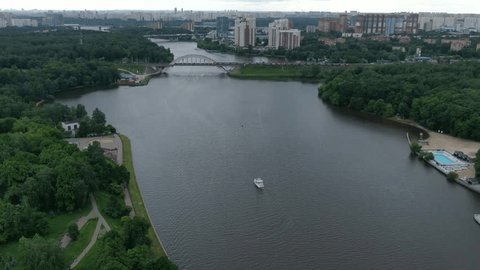 Aerial Pullback over River Urban District