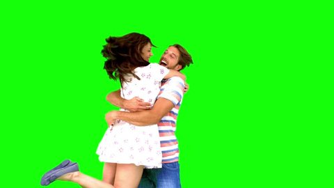 Couple meeting again on green screen in slow motion