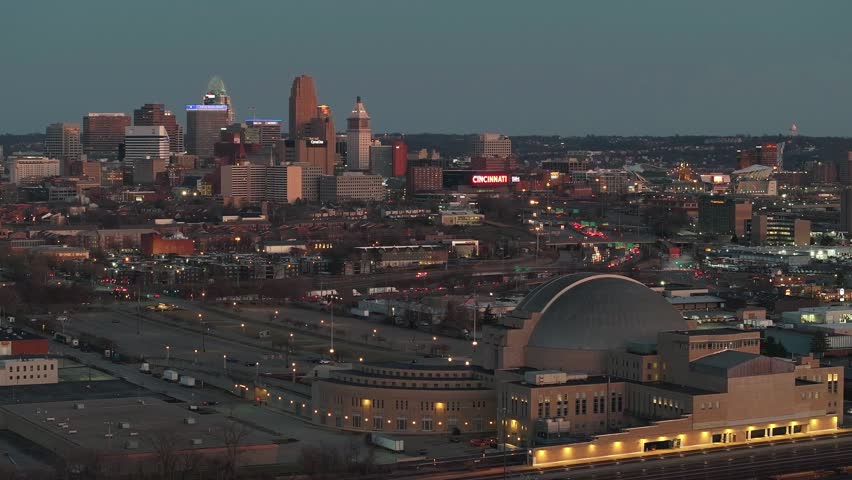 Aerial view of the illuminated Union Terminal with the Cincinnati skyline, a blend of modern towers and historic architecture, Cincinnati, Ohio, United States.