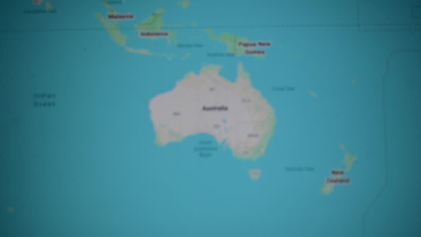 Map of Australia under magnifying glass shows states and geography. Tasmanian links continent scale new zealand proximity, ocean routes, desert landscape, economy relationship.