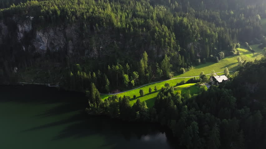 Aerial panorama of Piburger Lake in Tyrol Austria with green forests and alpine mountains stunning landscape and travel destination