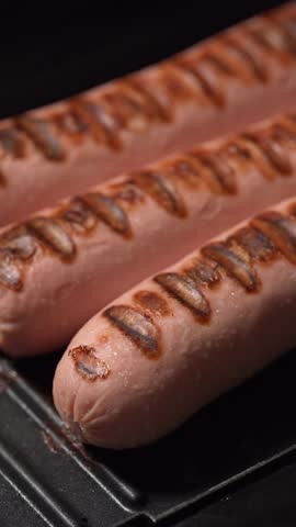 Grilled sausages on a home electric grill. BBQ sausages.	