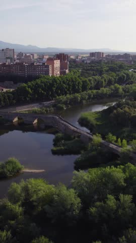 Vertical aerial shot capturing the historic Puente Romano de Santa Catalina in Talavera, Spain.