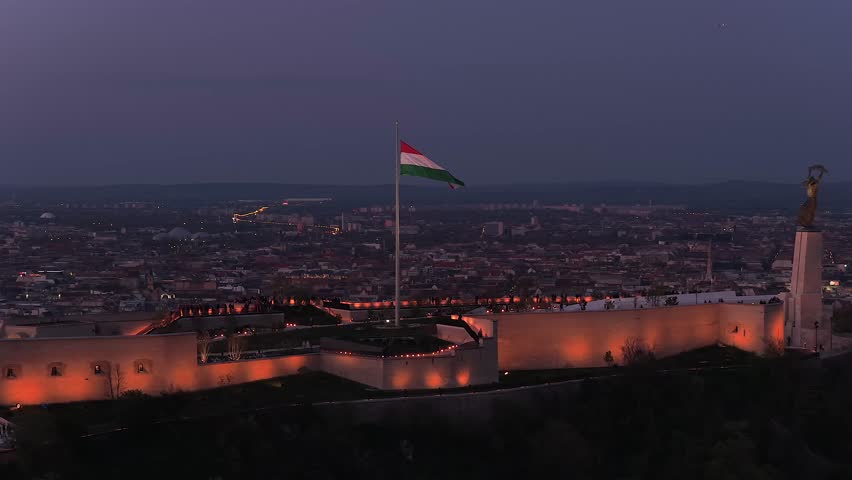 Renovated Liberty Statue, Szabadság Szobor, Citadella visitor center and Hungarian flag on Gellért Hill in Budapest, Hungary.
