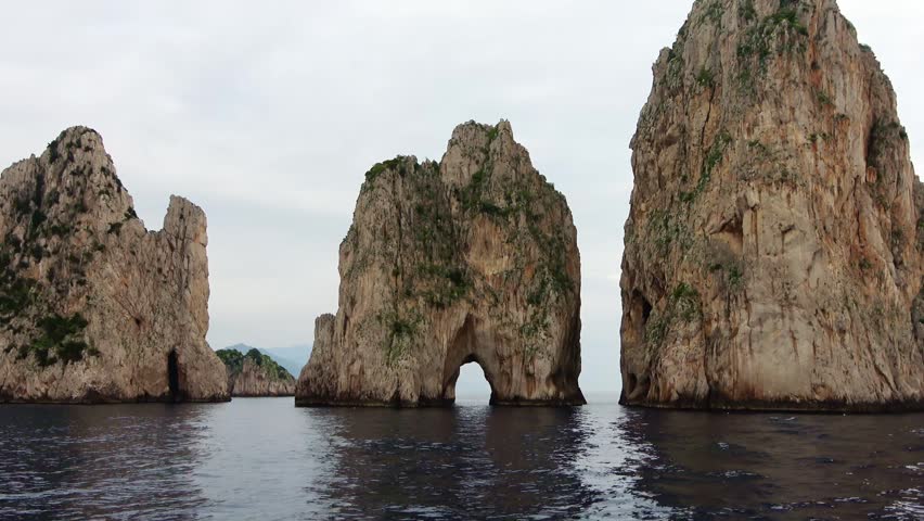 Panoramic view of the iconic Faraglioni sea stacks on the beautiful island of Capri, Italy