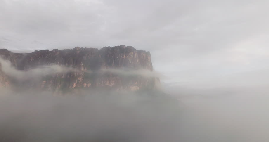 Scenic View Of Tepuis (table-top mountains) During Foggy Sunrise Within Canaima National Park In Venezuela. Aerial Shot