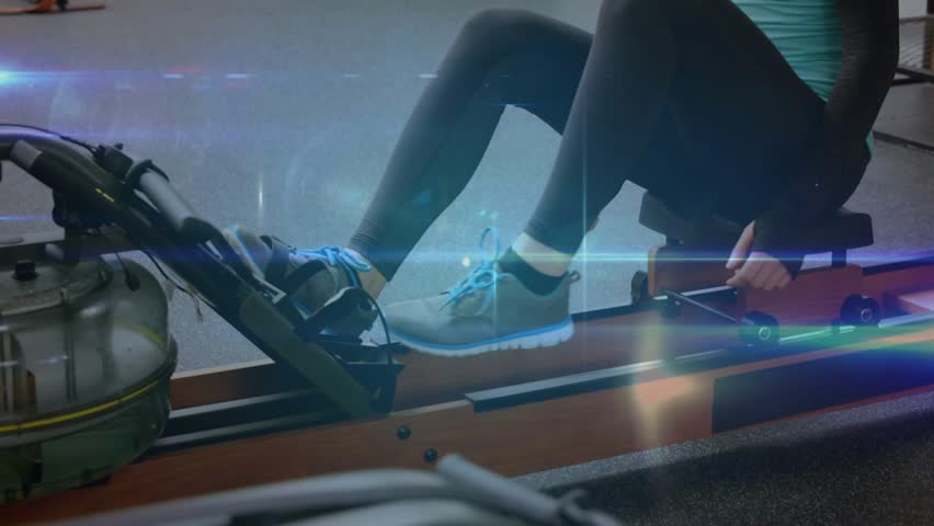 Fitness woman securing straps and gripping handle preparing to row as nodes highlighting joints. Ergometer, gym, analytics, data, advertising, training, athlete