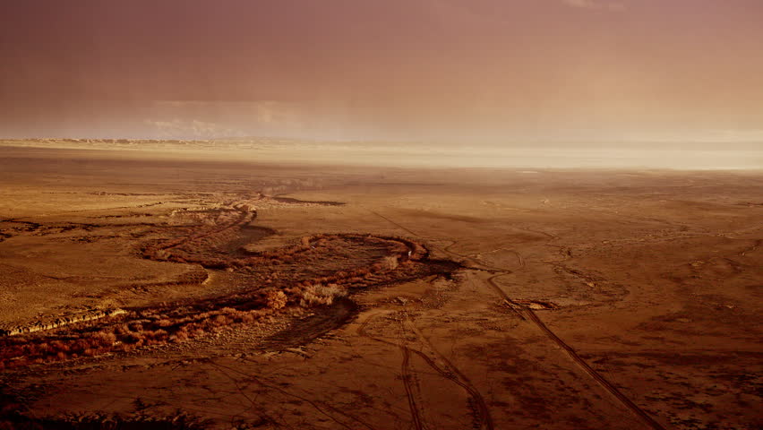 Dramatic aerial view of snow clouds overtaking the New Mexico plains landscape