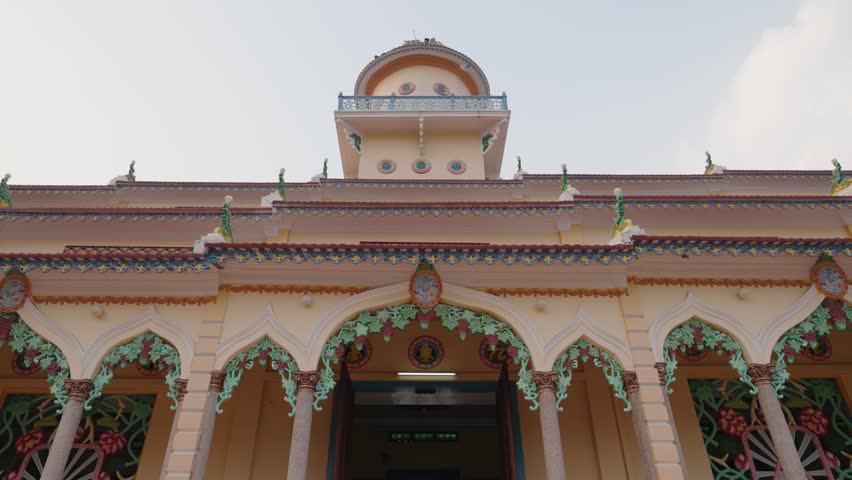 Side view of Cao Dai Temple architecture during sunset at Tay Ninh Holy See, Vietnam
