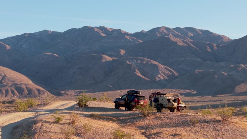 Discover aerial views of a teardrop camper and SUV camping along Thimble Trail in Anza Borego Desert State Park, California.