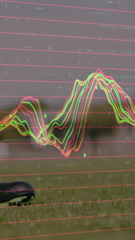 Vertical video: Woman entering, placing ball for sports while waveform overlay moving over scene. Soccer, athlete, turf, cleats, socks, groundlevel, vertical video