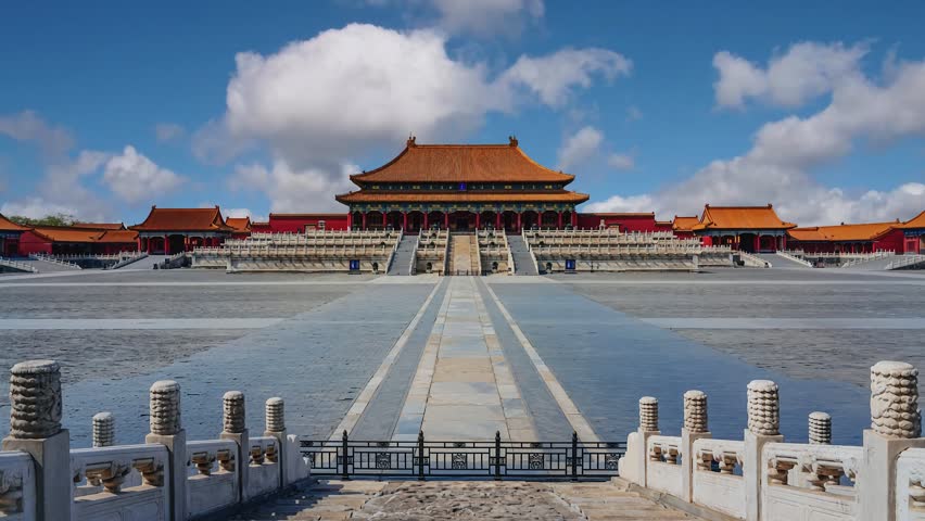 Timelapse video showcasing the grand Taihe Gate and Hall at the Forbidden City in Beijing, with clouds moving across the sky and emphasizing the imperial architecture.