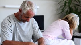 Mature couple arguing with each other in the bedroom - Powered by Shutterstock - Get 15% off with code: PIKWIZARD15