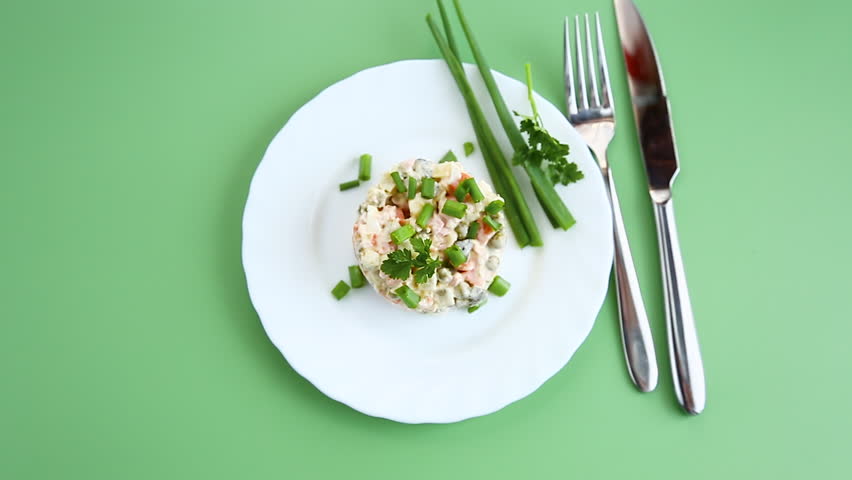 delicious creamy potato salad with peas carrots and green onion
