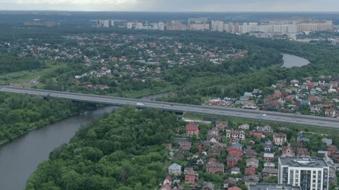 Sideways Aerial Movement above River Residential District