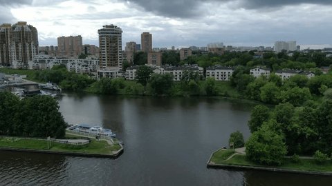 Aerial View Flying over River Docked Boats