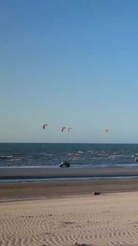 The kitesurfers sailing off the coast of northeastern Brazil