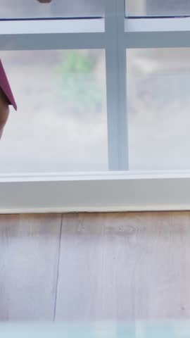 Vertical video: Pair tapping tablet and checking stats in business, making pin bell likes updating. Office, collaboration, teamwork, professionals, meeting, mobile, vertical video