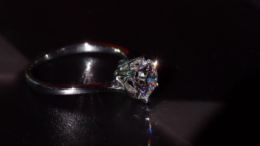 Dazzling Diamond Gold Ring Appears in Soft Artistic Macro Shot. Featuring Clear Facets and Smooth Metal Curves. Refined Show of Luxury, Beauty and Craftsmanship With Mesmerizing Precision Close-up 4k