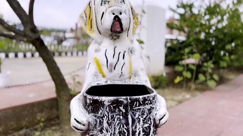 A tiger shaped dustbin in wildlife public park 