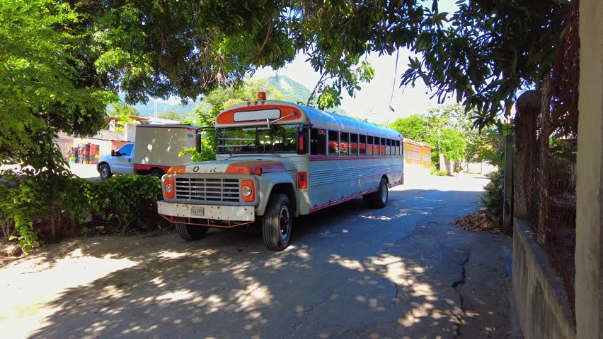 POV shot of a large, parked bus in the beach town of Choroni, Aragua, Venezuela