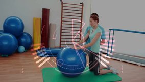 Vertical video: Trainer kneeling holding ball and cueing client leaning forward reaching for rehab. Mobility, stretching, clinical, gym, posture, alignment, guidance - Powered by Shutterstock - Get 15% off with code: PIKWIZARD15
