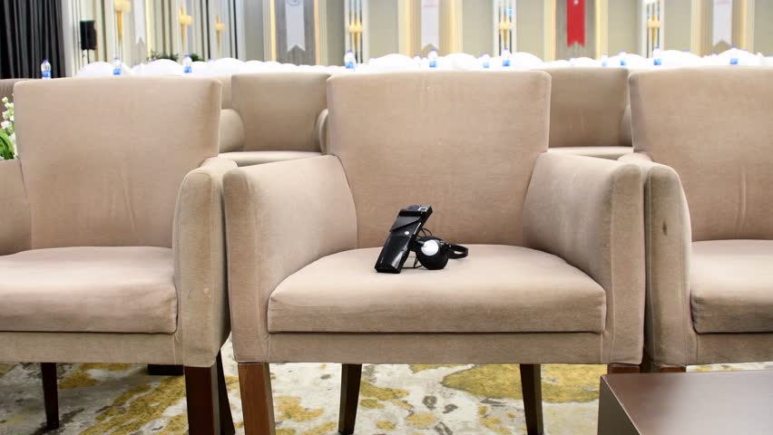 Empty Conference Hall with Microphones Ready for Business Meeting.