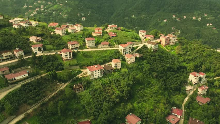 hilly terrain countryside northern Turkey, Trabzon plateau landscapes, pastoral scenery, tranquil rural nature, traditional village houses, green hills, misty mountains, scenic travel photography, authentic culture.