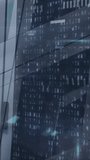 Vertical video: Glass facade pulsing node sending icons linking settling showing tech network. Skyscraper, exterior, urban, reflections, overlay, cyan, vertical video - Powered by Shutterstock - Get 15% off with code: PIKWIZARD15