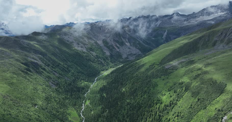 Aerial view of beautiful high altitude lake and snow capped mountain landscape