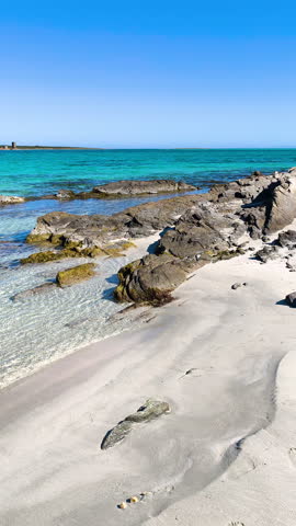 Vertical panning of La Pelosa Beach in Stintino Sardinia in springtime