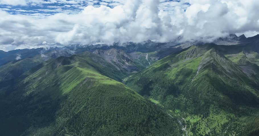 Aerial view of beautiful high altitude lake and snow capped mountain landscape