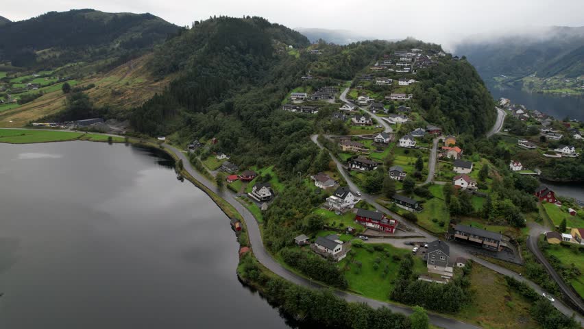 Haus village on Osteroy near Bergen in Vestland Norway with church roads and fjord landscape