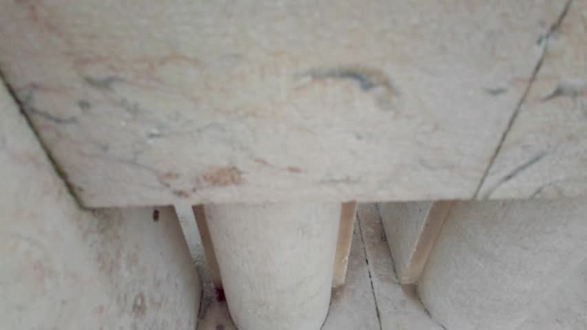 Revealing shot of Parque Eduardo VII in Lisbon, with its iconic geometric hedge patterns stretching into the distance towards the Marques de Pombal square under a cloudy sky