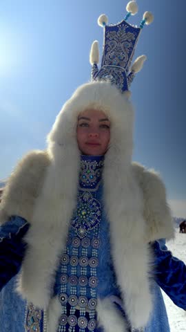 A woman in a traditional costume poses outdoors. The scene showcases vibrant colors and cultural details.