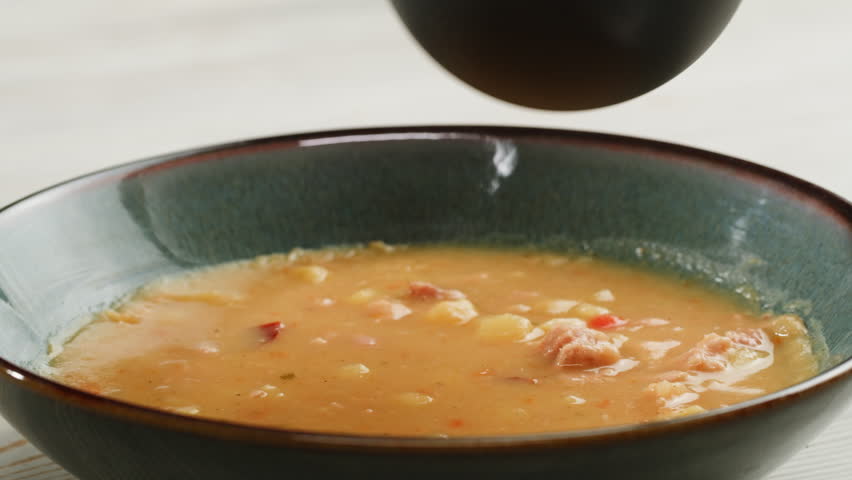 Split pea soup, Eating mashed pea soup with sausages and pork. Popular german or slavic food, winter street food.