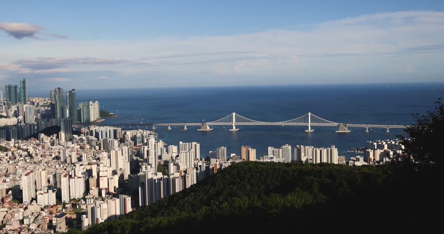 Busan city panorama beautiful skyline view from Hwangnyeongsan mountain observatory, Busan port, Gwangan bridge and harbor bay, South Korea, Yeongnam district, sunny day, travel to Republic of Korea