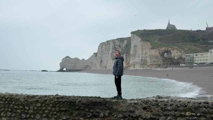 Exploring the coast of Etretat, France with cliffs and views of the sea in winter weather	
