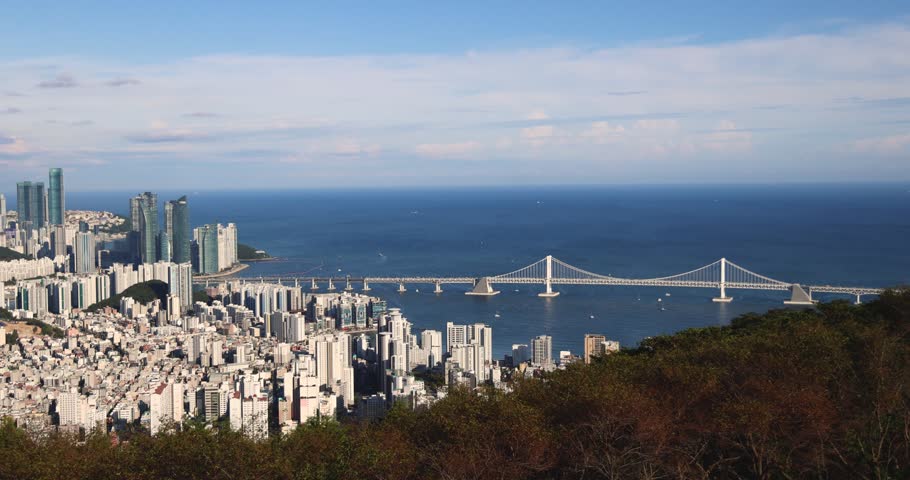 Busan city panorama beautiful skyline view from Hwangnyeongsan mountain observatory, Busan port, Gwangan bridge and harbor bay, South Korea, Yeongnam district, sunny day, travel to Republic of Korea
