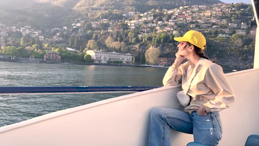 Woman Relaxing on Lake Como Boat Cruise Enjoying Scenic Village Views, Travel Lifestyle Experience in Italy Tourism Destination