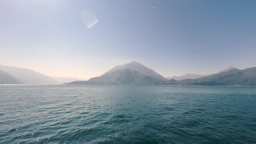 Lake Lugano View Through Lush Park Vegetation with Monte San Salvatore Mountain, Scenic Nature Landscape for Travel and Relaxing Background