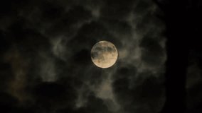 Mystical Full Moon Behind Clouds Dark Nature Background. Dark Sky Full Moon Atmospheric Night Background - Powered by Shutterstock - Get 15% off with code: PIKWIZARD15