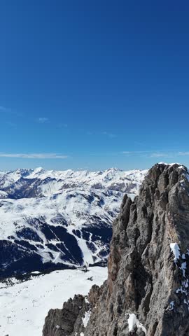 Aerial view of snowcapped hills of French alps by winter	