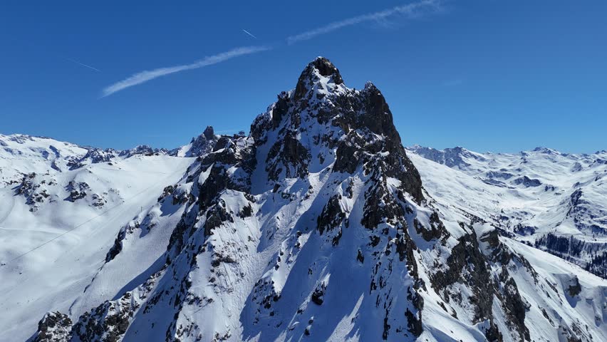 Aerial view of snowcapped hills of French alps by winter	