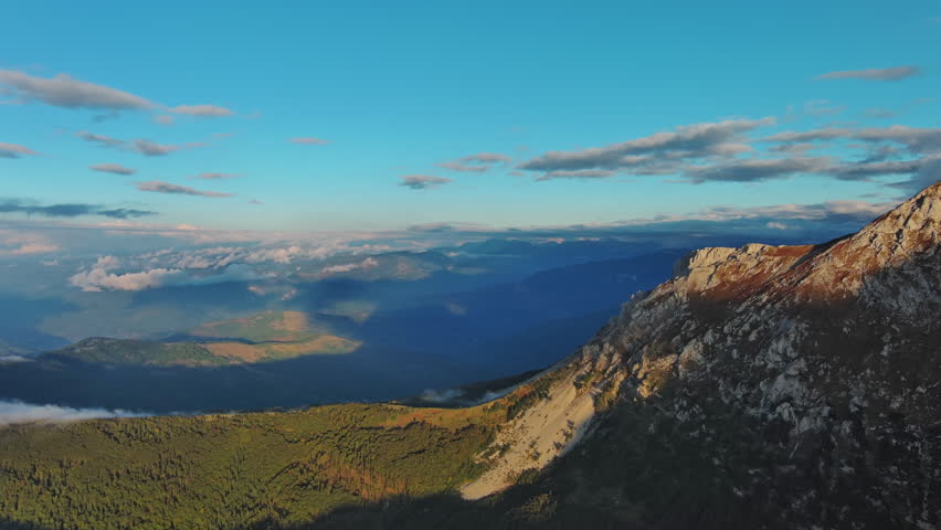 Aerial view of amazing rocky mountains at sunset, Komovi mountains in Montenegro, panorama, 4k