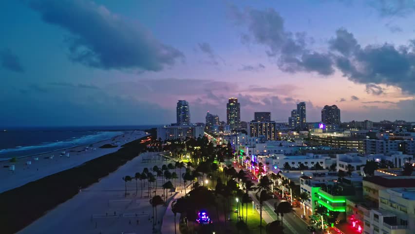 Miami beach sunset ocean skyline. Miami aerial bay cityscape night. Miami waterfront coastal dusk. Miami Ocean drive seaside evening.