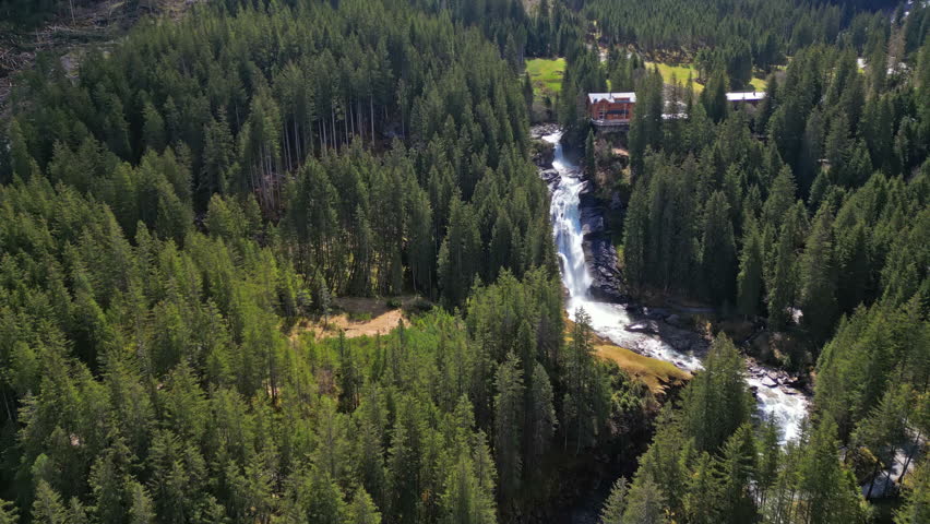 Aerial view of Krimml Waterfalls in forest mountain. High Tauern National Park, Austrian Alps, Austria, 4k